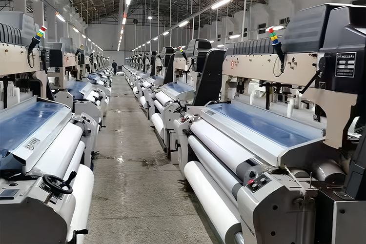 Skilled worker operating textile machinery